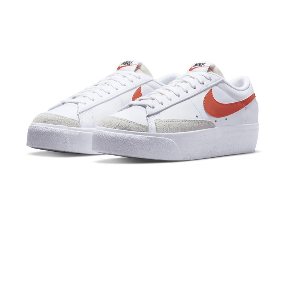 Nike Women's White Sneakers with Orange Swoosh